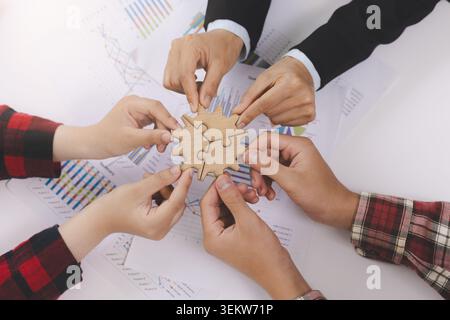 Business Teamwork and Collaboration with Puzzle Pieces. business strategy, innovation, team building, office collaboration, professional development, Stock Photo