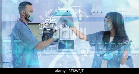 medical researchers in protective masks and gloves analyzing laboratory sample with digital dna interface, healthcare technology, biotechnology innova Stock Photo
