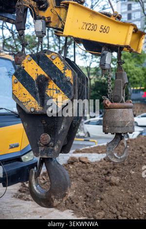 Heavy Duty Crane Hook and Pulley Block at Construction Site Close Up Industrial Lifting Equipment Stock Photo