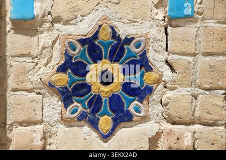 An example of Uzbek ceramic art. Geometric and floral motifs are frequently used in traditional tile art. Uzbekistan. Stock Photo