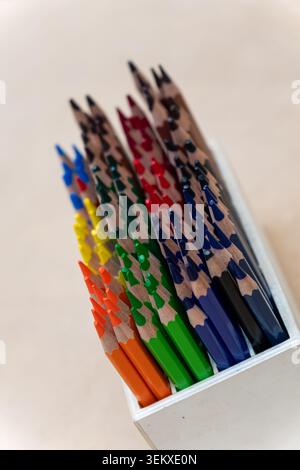Macro shot of sharpened colorful wooden pencils arranged in a color gradient Stock Photo