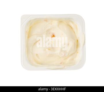 Yogurt cup isolated, yoghurt in plastic pot, spoon in milk pudding container, dairy food small package on white background Stock Photo