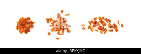 Dried chopped carrots isolated on white background top view. Dry carrot flakes, dehydrated orange vegetable pieces collection Stock Photo