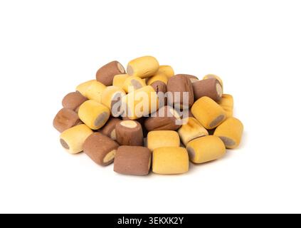 Filled dog biscuits, crackers isolated, soft crunchy pet treats pile, flavored small canine cookie, stuffed biscuits, puppy training food on white bac Stock Photo