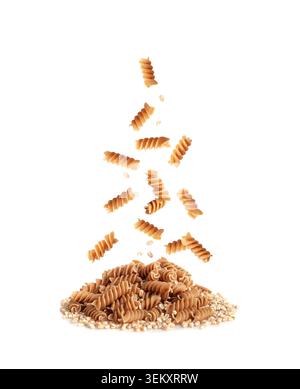Falling Raw Brown Pasta Isolated, Wholegrain Fusilli Pile, Flying Dry Whole Grain Noodle, Raw Spelt Macaroni, Wholewheat Spiral Pasta on White Backgro Stock Photo