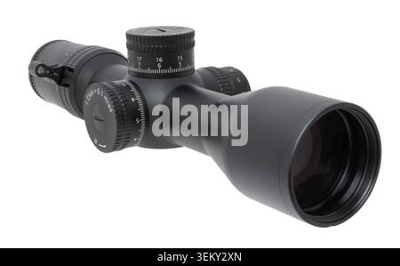 Telescopic riflescope that is black with large adjustment dials seen at a angle toward the front isolated on a white background. Stock Photo