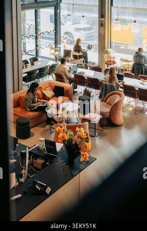 High angle view of creative entrepreneurs and freelancers working in coworking hub Stock Photo