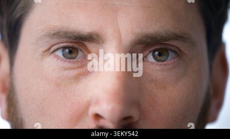 Close up male eyes looking at camera confident calm serious face expression Caucasian businessman look business man headshot indoors wisdom concept Stock Photo