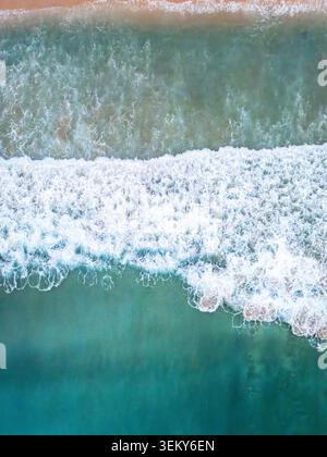 sea waves breaking and crashing surface by drone, abstract water wave shapes Stock Photo