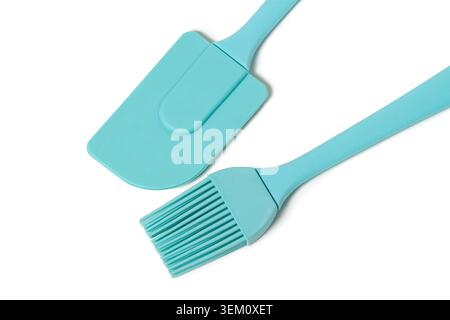 Top view horizontal closeup of mint green silicone spatula and baking pastry brush set isolated on white copy space background Stock Photo
