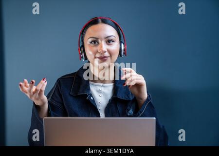 Professional customer support representative communicating through digital channels. Suitable for customer service, technical support, call centers, o Stock Photo