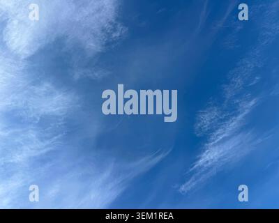 Light cirrus clouds in the blue sky Stock Photo