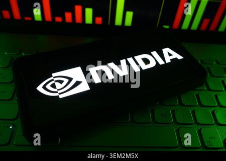 Nvidia GPU And Artificial Intelligence Chip Company Logo On A Screen With A Live Stock Chart In The Background Stock Photo