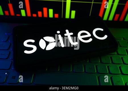 Soitec Semiconductor Engineered Substrate Materials Company Logo On A Screen With A Live Stock Chart In The Background Stock Photo