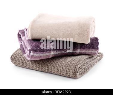 Stack of cozy blankets isolated on white background Stock Photo