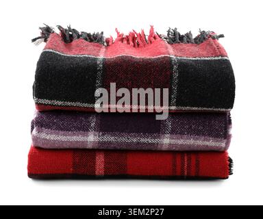 Stack of cozy blankets isolated on white background Stock Photo