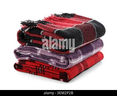 Stack of cozy blankets isolated on white background Stock Photo