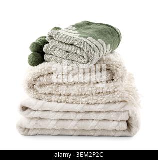 Stack of different cozy blankets isolated on white background Stock Photo