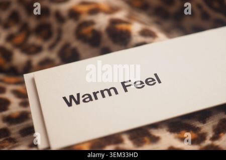 Warm feel sign on a leopard print background Stock Photo