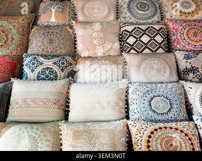 Collection of patterned cushions and decorative pillows showcasing traditional Middle Eastern craftsmanship Stock Photo