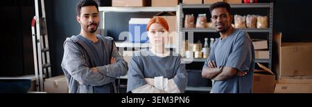 Portrait of Diverse Adult Volunteers Working in Humanitarian Aid Center Stock Photo