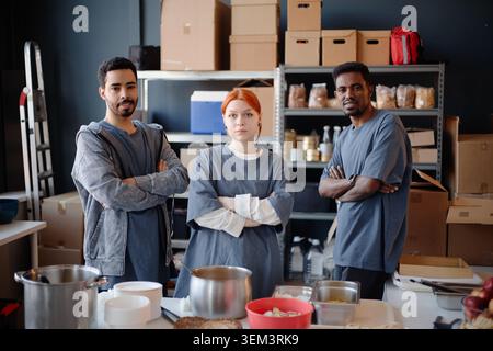 Portrait of Diverse Volunteers Working in Humanitarian Aid Center Stock Photo