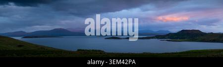 Extra wide shot of Badentarbat Bay from Achiltibuie under a sunset cloudy sky, Scotland Stock Photo