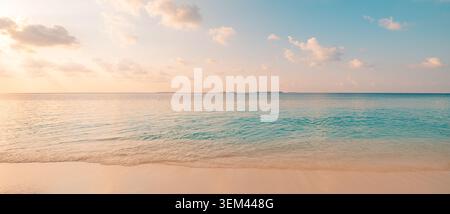 Delicate pastel ocean blending into pale morning sky. Wide calm tropical sea minimal horizon. Peaceful seascape wellness background copy space Stock Photo