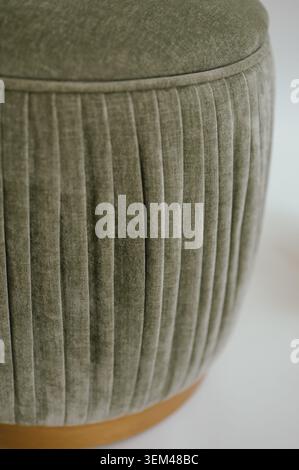 Close up detail of a plush green velvet ottoman with ribbed texture Stock Photo