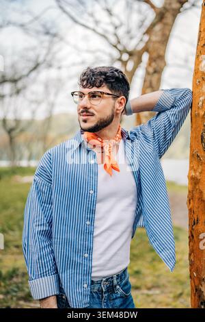 Young man posing in casual stylish outfit outdoors Stock Photo