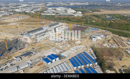 Aerial drone view of a massive hyperscale data center under construction in Chonburi, Thailand, showing cloud infrastructure, AI computing and industr Stock Photo