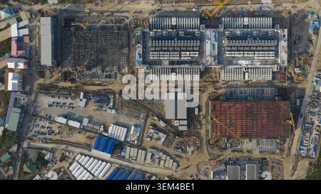 Aerial drone view of a massive hyperscale data center under construction in Chonburi, Thailand, showing cloud infrastructure, AI computing and industr Stock Photo