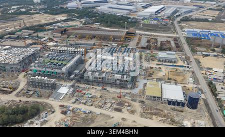 Aerial drone view of a massive hyperscale data center under construction in Chonburi, Thailand, showing cloud infrastructure, AI computing and industr Stock Photo