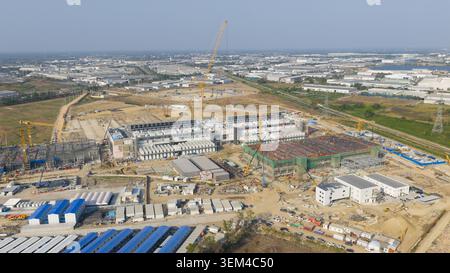 Aerial drone view of a massive hyperscale data center under construction in Chonburi, Thailand, showing cloud infrastructure, AI computing and industr Stock Photo