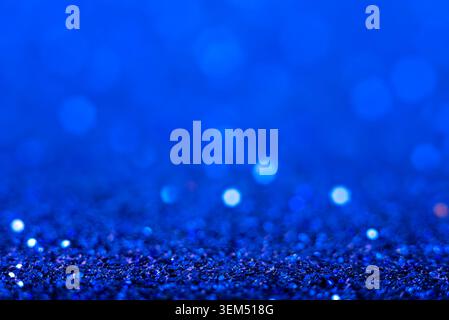 Bright blue glitter creates a shimmering background. Stock Photo