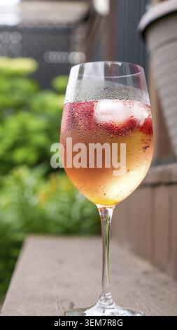Fresh summer cocktail with strawberry and ice cubes. Glass of strawberry soda drink on dark background. Fresh strawberry cocktail Stock Photo