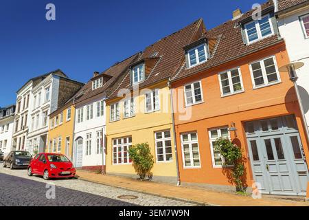 Empty street of a small European town. Colored historical houses in the traditional german-danish style. Flensburg, Germany Stock Photo