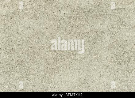Concrete or cement wall with small stones, gravel, texture background Stock Photo