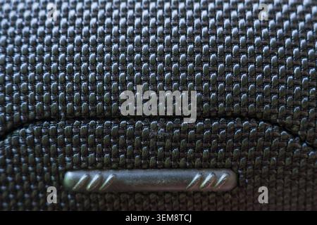 Close up view showcasing vehicle interior detail with black plastic grid pattern texture on compartment, evoking sleek modern feeling of calm professi Stock Photo