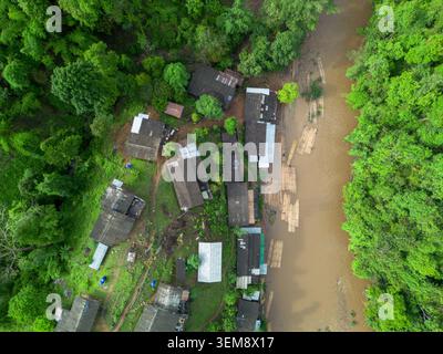 Aerial view of a rustic house nestled in a vibrant autumn landscape ...