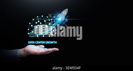Hand holding digital infrastructure network overlay with data center servers, rocket launch on dark copy space. Cloud computing management, big data s Stock Photo