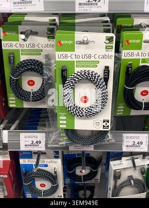 Cremona, Italy - May 9th 2026 Sologic USB C to USB C, USB A to USB C and 8 pin cables displayed on a retail shelf, boxed and ready for charging and da Stock Photo