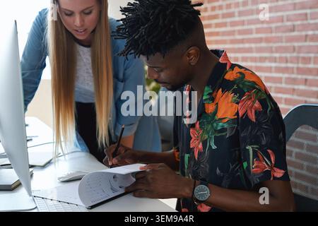 Training, programming and people in office with document, data analysis and report for server update. Team programmer or reading with pc for IT Stock Photo