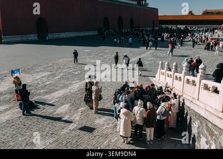 Crowds of tourists visiting the Meridian Gate at the Forbidden City Beijing, China: Wide angle view of the majestic Meridian Gate entrance to the Stock Photo