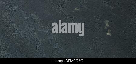 Dark textured concrete wall surface with rough weathered finish Stock Photo