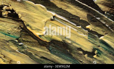 Abstract fluid art with flowing gold and black paint creating dynamic marble texture Stock Photo