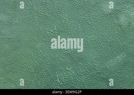 Mint green painted wall texture with rough brushed surface and vintage aesthetic Stock Photo
