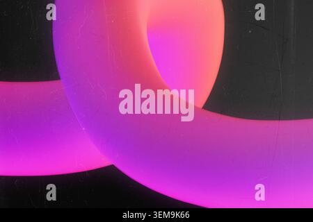 Intersecting 3D pink and purple neon rings on a dark vintage textured background with dust Stock Photo