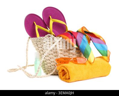 Knitted bag with beach accessories isolated on white Stock Photo