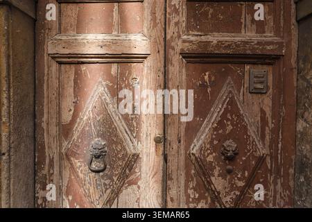 BACKGROUND TEXTURE OF AN OLD WOODEN DOOR Stock Photo